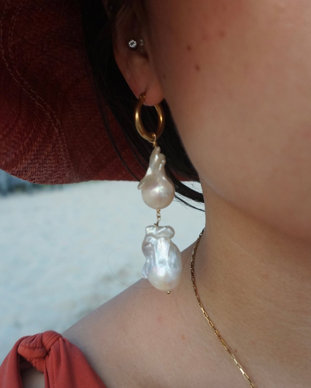 Model in Aelia Double Big Baroque Pearls Earrings - 18K Gold Plated