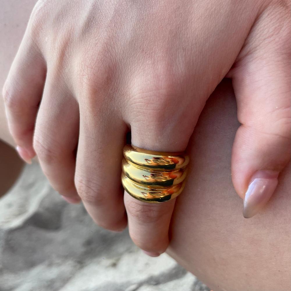 Model in chunky gold ring